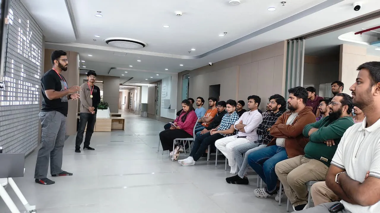 Yash Sharma leading a session with his team
